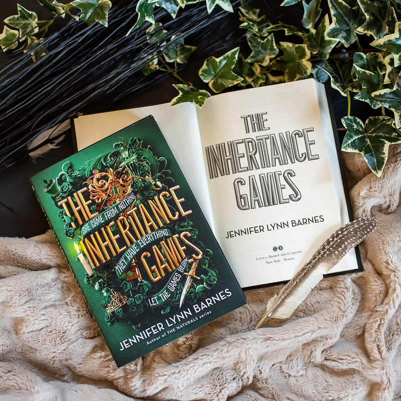 The Inheritance Games novel with feathers and vines